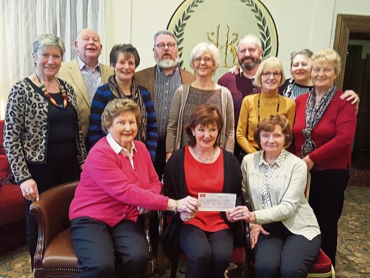 Newbridge carol singers donate &euro;9,000 to two charities