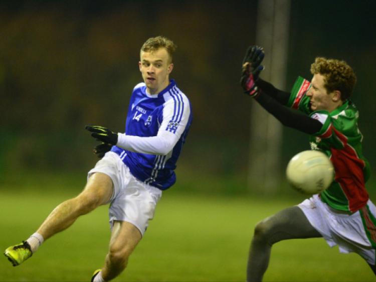 Monastrevan's Daniel Dee shoots past Colin O'Modhrain of Suncroft in the Tony Donohoe Trophies Under 21 Shield final at Hawkfield.