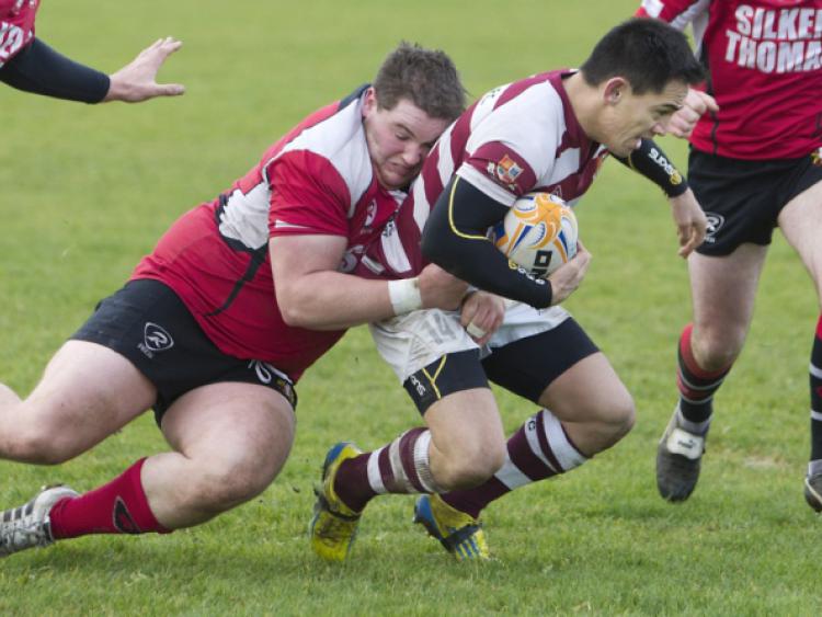 Tullow`s Massey Tuhakaraina trying to escape Chill Dara`s James Murphy.