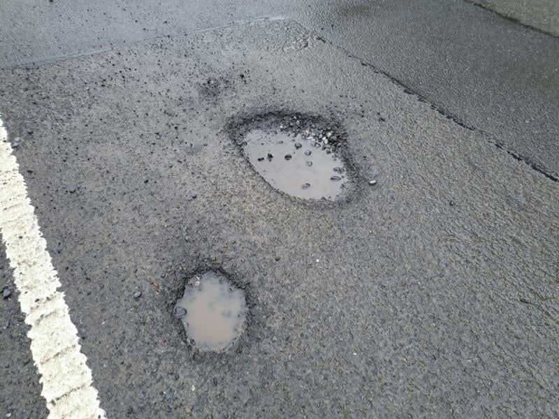 'Urgent' repairs sought for 'numerous large potholes' affecting this ...