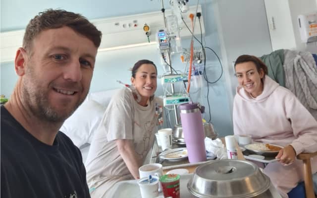 Marathon runner Stephen Robotham visiting the hospital ward of wife Niamh McCabe where she reunited with her kidney donor and best friend Lyndsay Daly post transplant