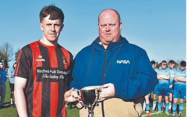 KDFL's Jamie Connolly presents Clane Captain Adam Hinds with the U20 Cup, Photo by Michael Anderson