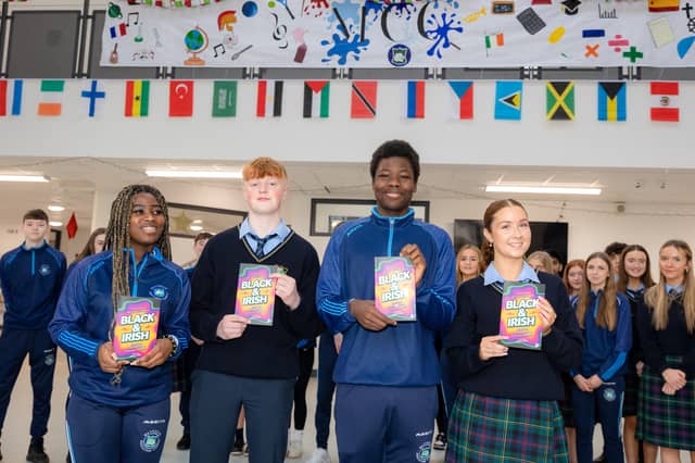 Students receiving the books