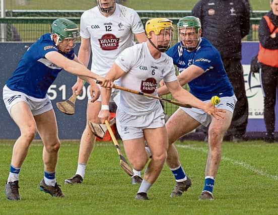 Kildare's Simon Leacy under pressure from Laois players in their Division 2A clash, Photo by Sean Brilly