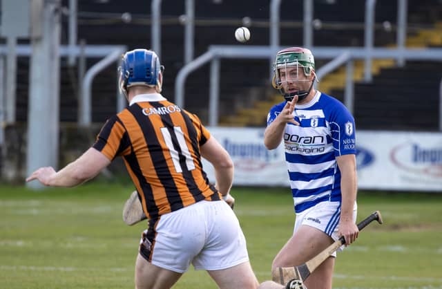 Naas wing back Kevin Whelan hands passes the sliotar clear during the AIB Leinster Senior Hurling Championship game against Camross (Laois)