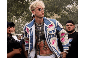 The rapper mentioned working in the studio with F1 driver Lewis Hamilton before challenging the reporter to play air guitar | PICTURE: Machine Gun Kelly Instagram page