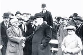 Harry Beasley (72) Champion Jockey being greeted by the Governor General Tim Healy at the April 1923 Punchestown meeting