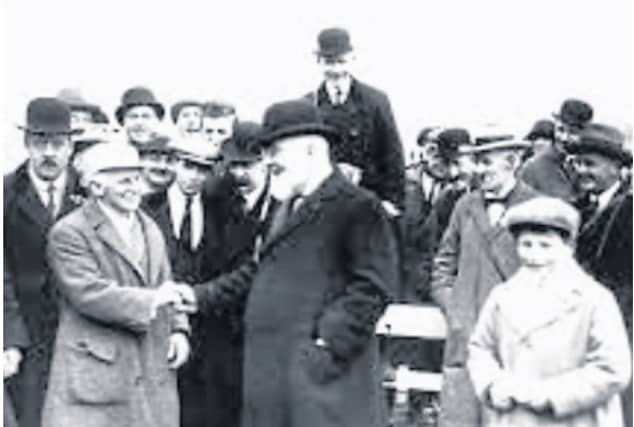 Harry Beasley (72) Champion Jockey being greeted by the Governor General Tim Healy at the April 1923 Punchestown meeting