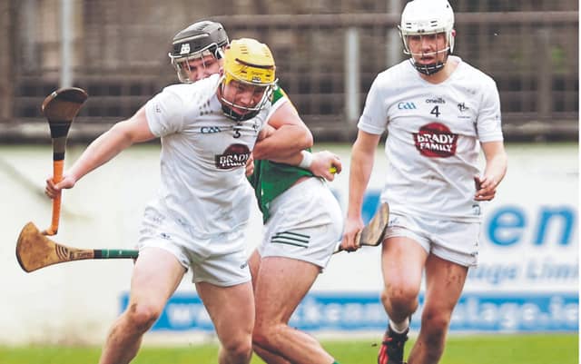 Kildare full back, Simon Leacy, shows his strength and determination as he breaks clear to make a clearance in the Kildare v Kerry AHL clash. Photo: Sean Brilly