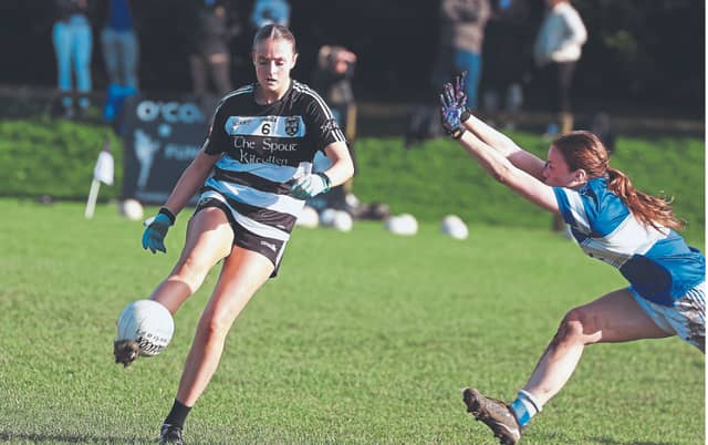 Kilcullen Molly O'Loughlin delivers her foot pass into the full forward line, Photos: Sean Brilly
