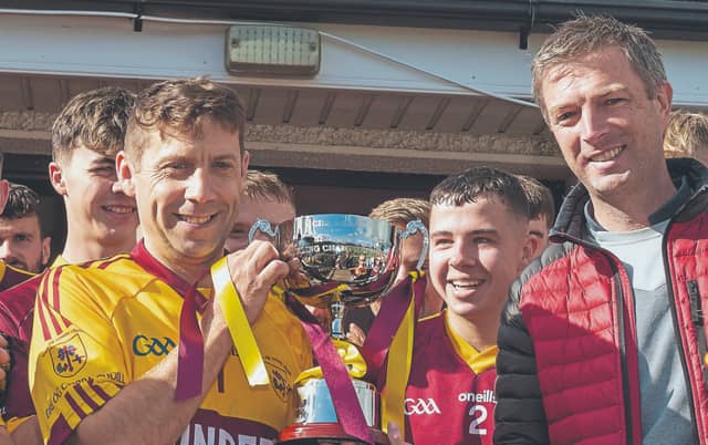 Éire Óg Corra Choill Captain Paul Dermody accepts the SHC 'B' Cup from Alan Dunney. Photo: Sean Brilly