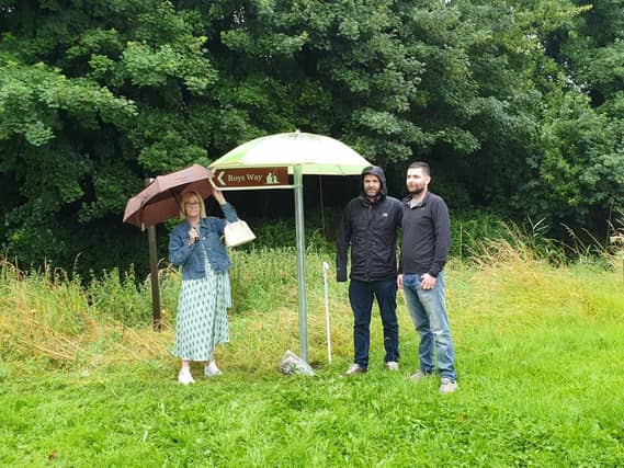 Caitriona Hopkins with sons Brian and Aaron at the memorial site in Rathangan