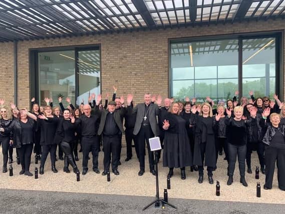 Newbridge Gospel Choir singing at Newbridge Parish Race Day at the Curragh with Fr Ruairi and Bishop Denis Nulty