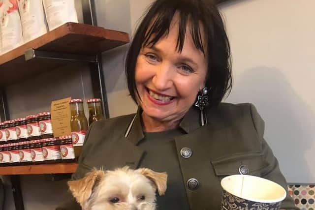 She accompanied her statement with a photograph on her social media profiles, showing her at a café with a dog. 