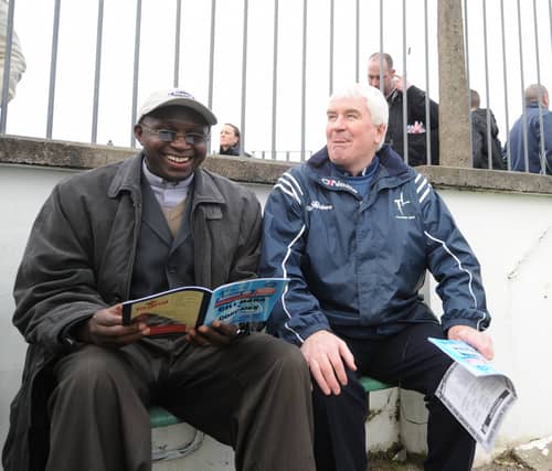 Fr Jimmy Doyle picture din a ‘bucket seat’ in St Conleth’s Park Newbridge with a Tanzanian priest friend