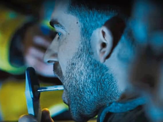 A motorist taking a roadside drug test