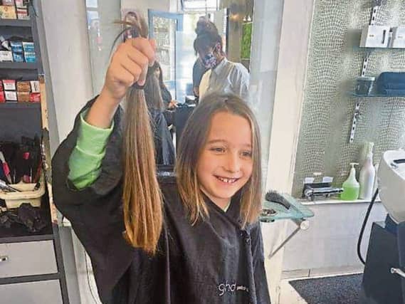 Elysia cut her hair for charity