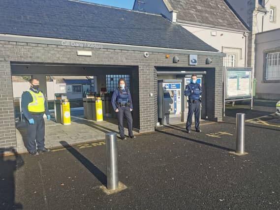 Garda Barry, Garda Harty and Sgt Gallagher enforcing Covid-19 regulations at Kildare Train Station