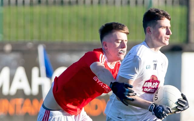 Darragh Swords looks at his options for a pass during the Minor Football Championship game against Louth