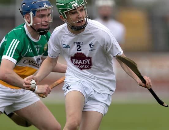 Kildare Peter O'Donoghue drives clear from the chasing Luke Nolan of Offaly during the Electric Ireland Leinster Gaa Minor Hurling Championship Quarter Final played at St Conleths Park, Newbridge