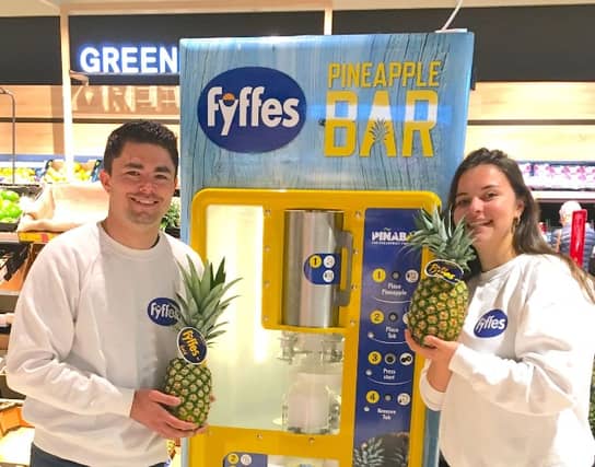 Sean Dockrell and Alice Marcoux with the high-tech pineapple chopper which will be in Newbridge this weekend