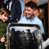 Jockey Donagh Meyler with his nephew Jim Kelleher, age 3, after winning the BOYLE Sports Irish Grand National Steeplechase on Soldier In Milan, Photo by Seb Daly/Sportsfile