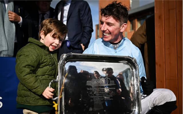 Jockey Donagh Meyler with his nephew Jim Kelleher, age 3, after winning the BOYLE Sports Irish Grand National Steeplechase on Soldier In Milan, Photo by Seb Daly/Sportsfile