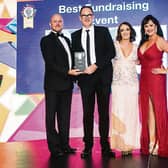 Brian O Reilly, presenting Alan Bannon  with the award for  along with Valerie Grogan and Helen O'Dwyer