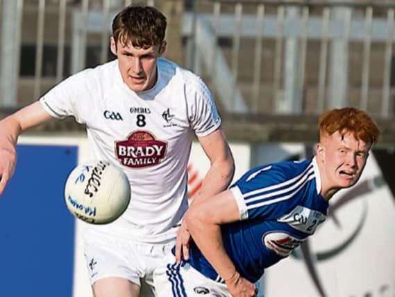 Kildare Aaron Masterson wins the race to the breaking ball ahead of Laois James Kelly during the Eirgrid Leinster U20 Championship