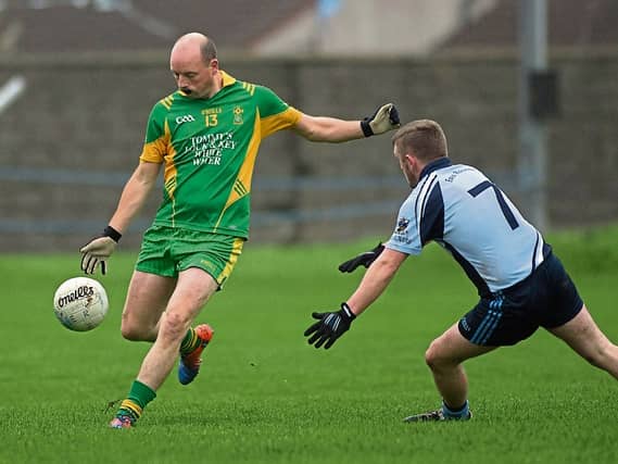 Ballymore's Eoin Kavanaghe looks to get his shot away with Declan Buckley of Erin Rovers, in the Leinster Club JFC. Photo: Ger Rogers/Adrian Melia Photo