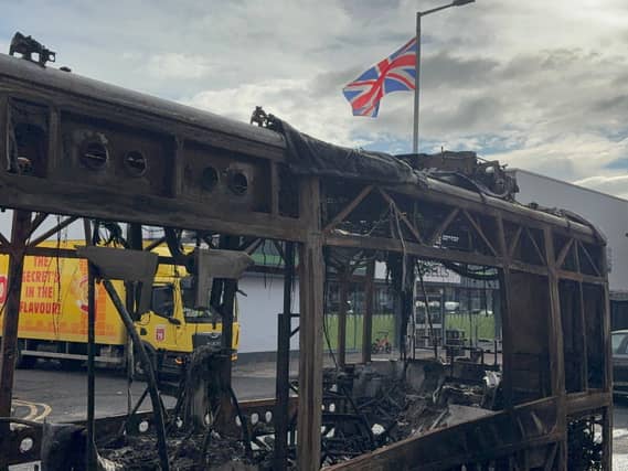 A burned out Glider bus on Newtownards Road in east Belfast after violence erupted on Tuesday night following a stabbing attack in the Kinnaird Avenue residential area