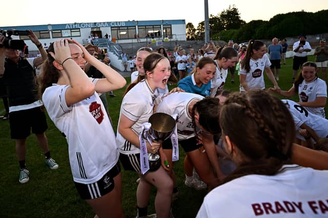 Kildare captain Amy Wall celebrates with the cup alongside teammates after the 2026 AirNav Ireland All-Ireland U-16 A Championship final match between Cavan and Kildare at Páirc Chiarain in Westmeath. Photo by Seb Daly/Sportsfile