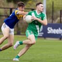 Sarsfields forward Ben Loakman tries to get away from Evan Boyle of Carbury in the Kildare SFC