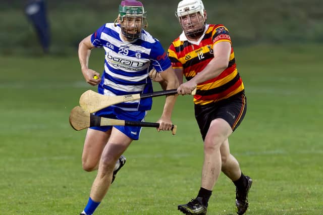 Naas Kevin Whelan goes past Ardclough Jonathan Reeves during the Senior Hurling Championship Round 1 game