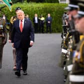 Donald Trump inspects a guard of honour during his visit to Dublin