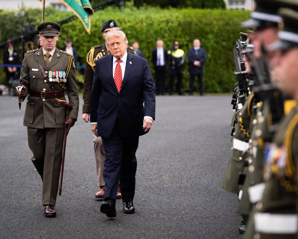 Donald Trump inspects a guard of honour during his visit to Dublin
