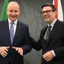 Taoiseach Micheál Martin and Prime Minister Andy Burnham laughing together at No 10 North in Manchester