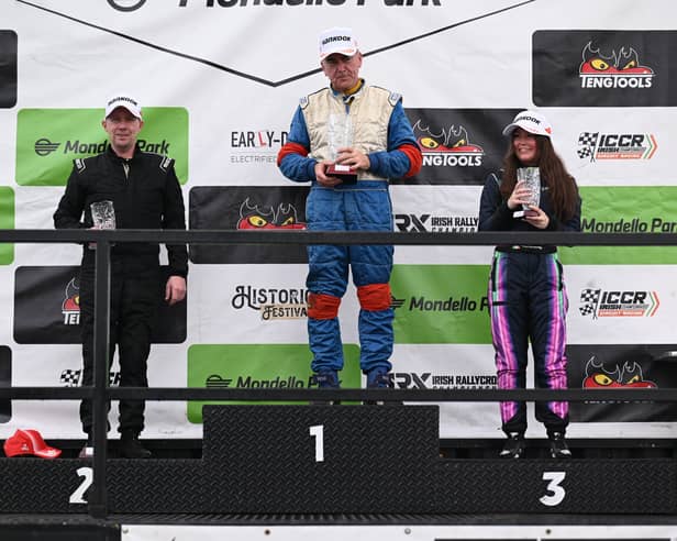 Róisín on the Mondello Podium with champion race drivers Richie Kearney, left and Enda O'Connor, centre