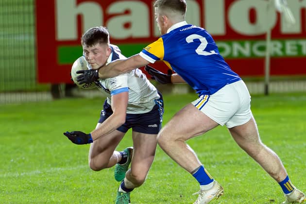 Allenwood Eoin Bagnall dips low to try and avoid the challenge from Dean Cummins Carbury