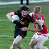 St Kevin's midfielder Jamie Smyth pushes his way clear from the challenge of David Lovely of Cappagh