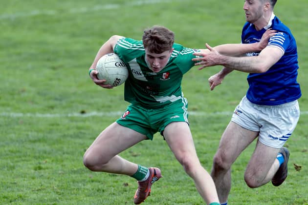 Sarsfields full forward Luke Mahon pushes himself clear of Celbridge Kevin Flynn