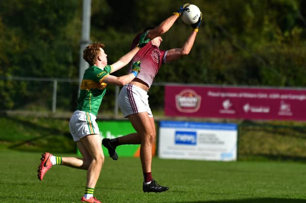 Caragh midfielder Dan Lynam fields the ball against Kilcock