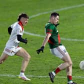 Milltown Alan Dignam openings the scoring of the Intermediate Football Championship 2026 with a point from play after he goes past Suncroft Chris Philips