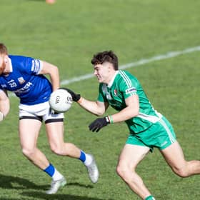 Sarsfields star Callum Bolton solo's past the covering Cian Bolger of Celbridge 