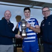 Tom Carew presents Tony Carew Cup to Naas Captain Conan Boran with Larry Curtin (Vice Chairperson Kildare Gaa) in attendance