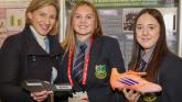 tand 2601 At the Stripe Young Scientist & Technology Exhibition, Nina Carberry, MEP and students Lauren Ryan and Kate Reidy from St Pauls Secondary School in Kildare, with their project