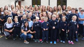 Kildare captain Aisling Holton brings cup to her pupils in Brannoxtown NS