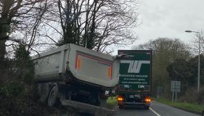 BREAKING: Dramatic scene as forty foot lorry leaves Kildare road