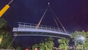 Up, up and away....Kildare's latest bridge is hoisted into place