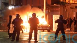 Garda&iacute; arrest 34 people after rioting in Dublin following school knife attack